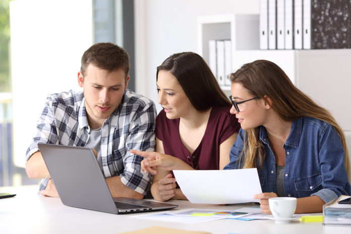 Team working together on line at office