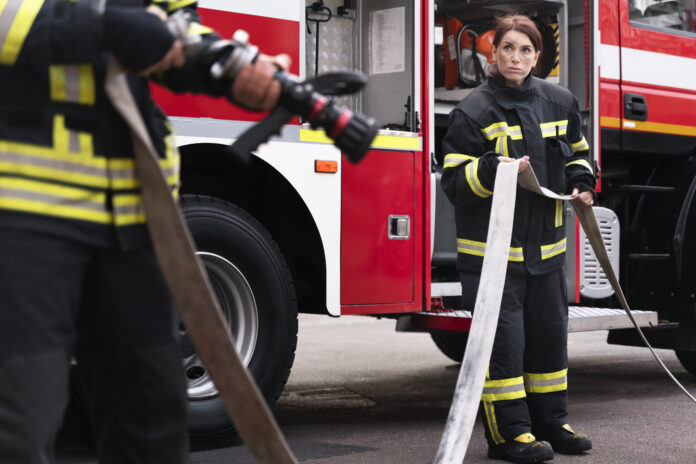 male-female-firefighters-station-working-together